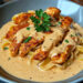 Tender chicken strips with creamy pasta in a rich sauce