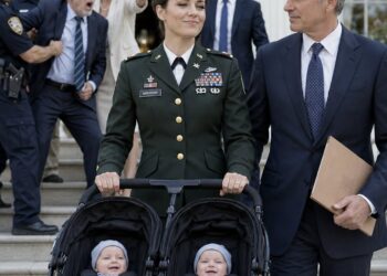 While carrying our twins, I stayed silent as the community credited my husband’s mistress with saving his parents’ property. Days later, he served me divorce papers in the hospital, calling me worthless and leaving without realizing my true rank as a U.S. Army colonel. He thought he had won, until I showed up again with a military escort, senior officers, and law enforcement standing behind me.