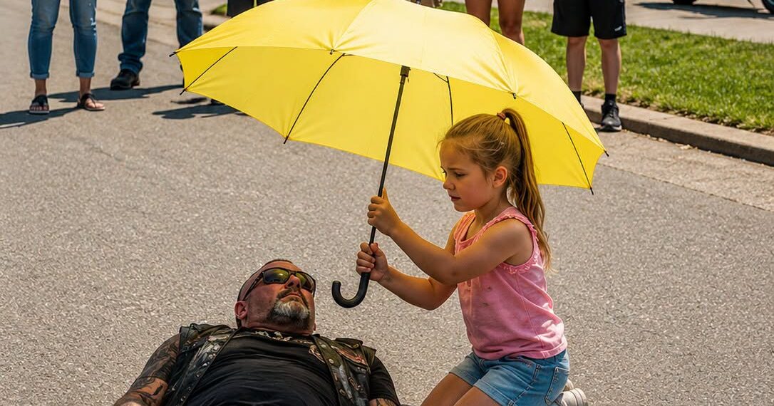 As Everyone Else Stood Back and Filmed a Biker Collapsing Beneath the Scorching Sun, Only One Eight-Year-Old Girl Walked Toward Him With a Yellow Umbrella… Moments Later, the Entire Crowd Witnessed Something They Would Never Forget