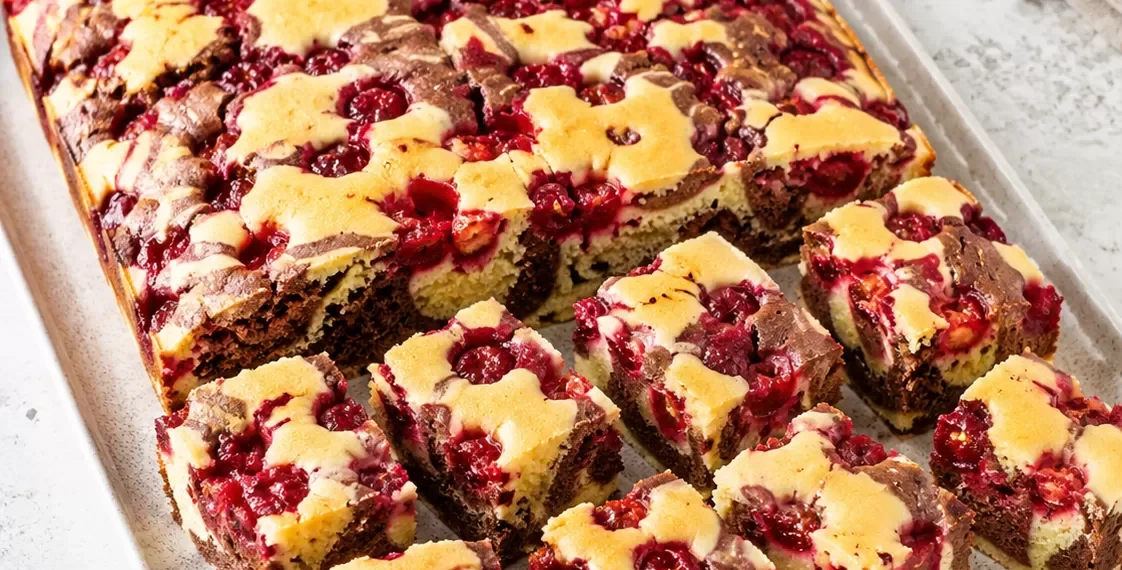 Marbled cake with cherries on a tray