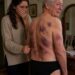 I came home to visit my elderly father, but when I offered to help bathe him, he shrank back in terror. “Please… don’t take off my coat,” he pleaded, his body trembling. The moment I carefully slipped it from his shoulders, I saw dark bruises and rope marks covering his fragile skin.