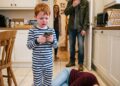 My husband br0ke my ri:bs and left me stru:ggl:ing to breathe on the kitchen floor while our five-year-old son watched. Instead of cr:yi:ng, my little boy picked up my phone and called the one person my husband never wanted involved. “Grandpa, come now. Mama can’t bre@the.” Minutes later, my husband returned and saw the phone in our son’s hands. “Who did you call?” he demanded. Then my father’s voice came through the speaker: “Me.”