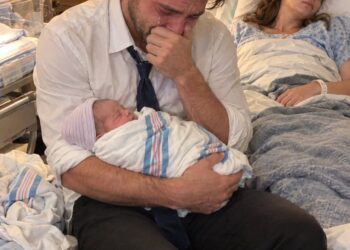 My son was only seven days old when I came home and found him seriously ill beside his unconscious mother. I rushed them both to the hospital, but the moment the doctor examined them, her face turned pale. She looked straight at me and shouted, “Call the police now!”